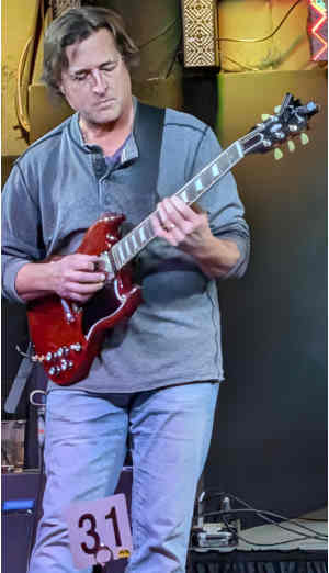 Coop rockin' out on an electric guitar lead