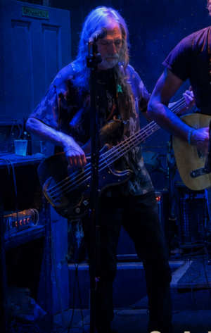 Ron Lasken playing bass guitar.